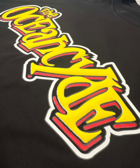 Oceancyde Puff Print Detail

Close up of yellow and red puff screen print Oceancyde logo on black shirt.

Raised puff print detail.